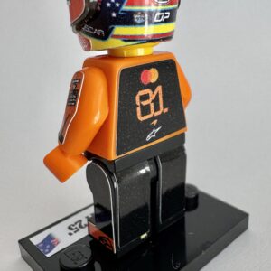 F1 Minifigure Oscar Piastri 2025 formula 1 grand prix pilota driver minifigure from the Brawn GP store collection.