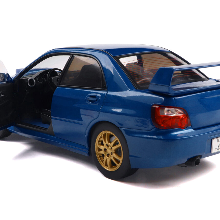 2003 Subaru Impreza WRX STI RHD (Right Hand Drive) Sonic Blue Metallic with Gold Wheels 1/18 Diecast Model Car by Solido Automotive